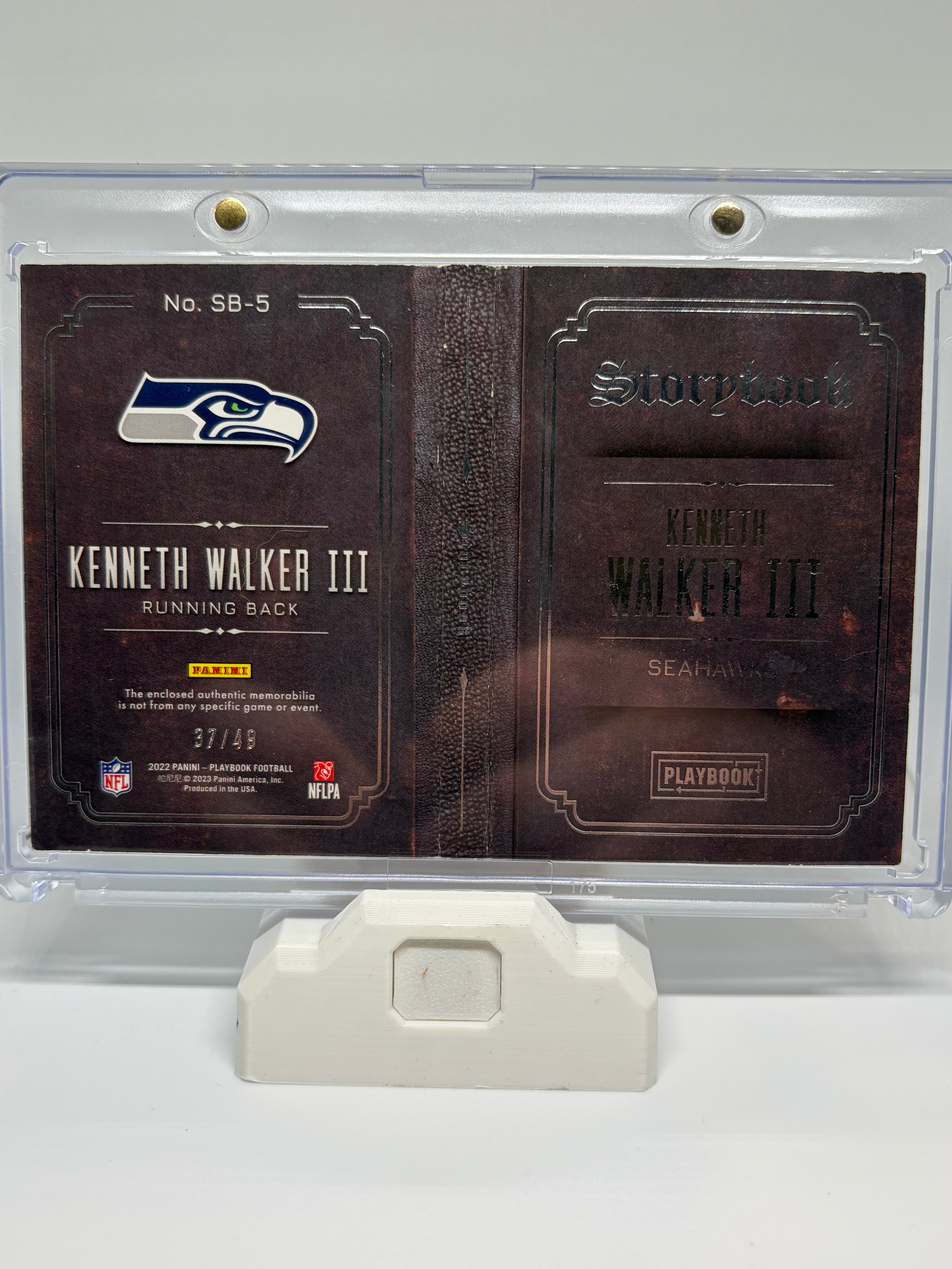2023 Panini Playbook Kenneth Walker III #SB-5 /49 RC Memorabilia Booklet